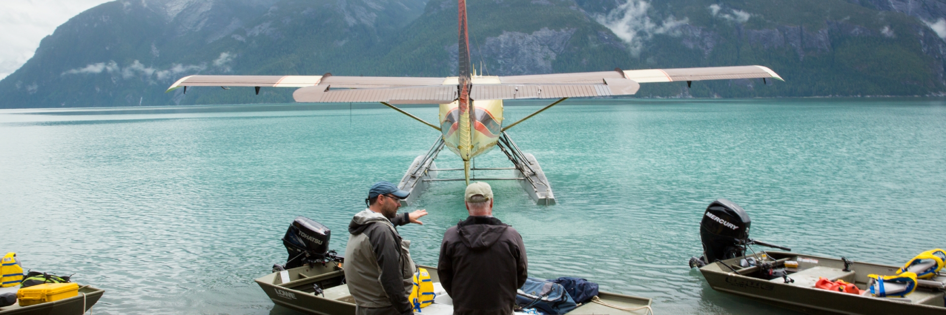 A group watching a float plane land in British Columbia.
